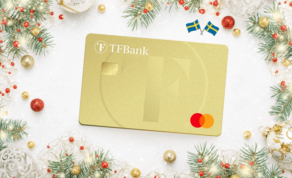 TF Mastercard Gold umrahmt von Weihnachtsdeko. Auf der Karte sind zwei kleine schwedische Flaggen abgebildet.
